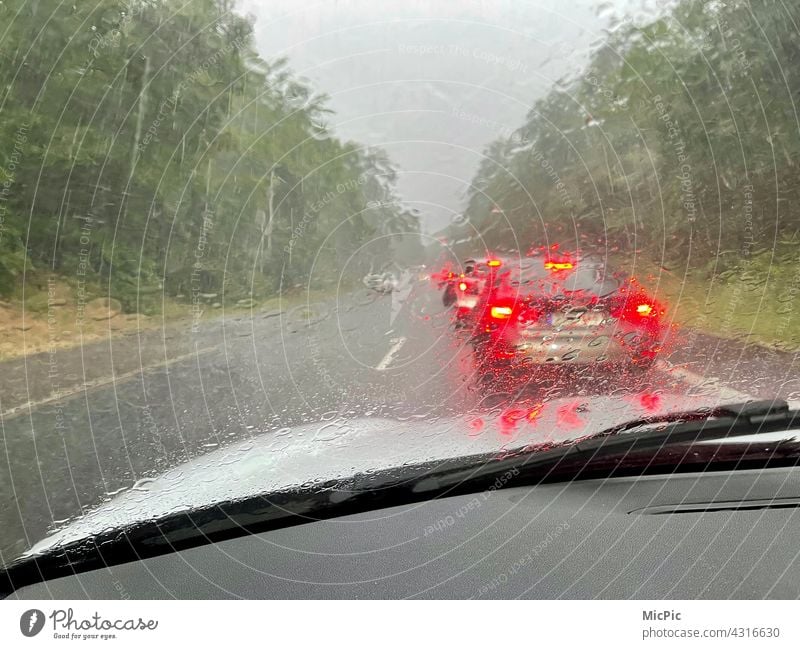 Rainy weather on the road - standing in traffic jams Road traffic Traffic jam Street Car Motoring Vehicle Rush hour Means of transport Storm Water clearer