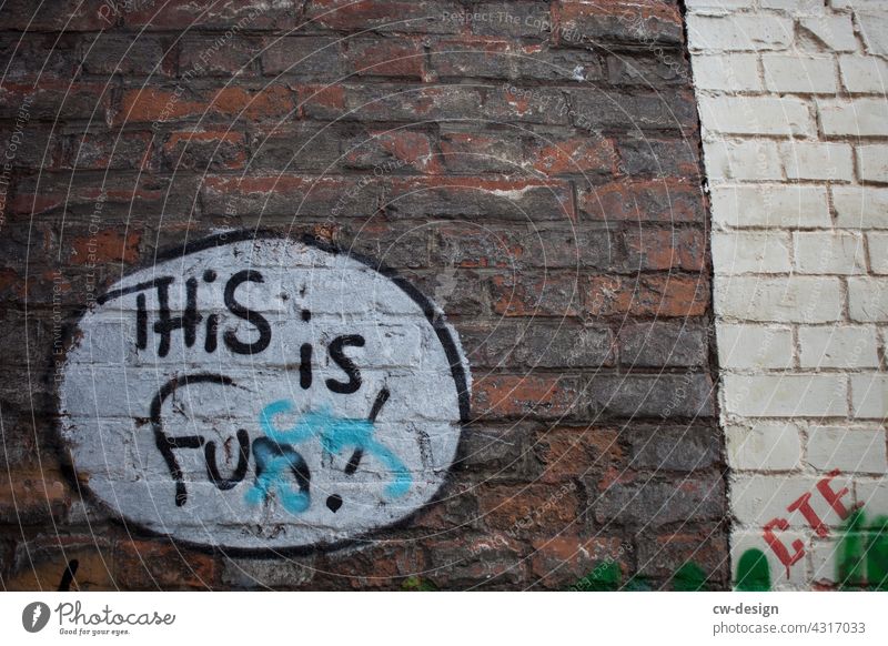 "THiS is fun" sprayed on a facade Facade Town House (Residential Structure) Architecture Building Living or residing Wall (building) street style street art