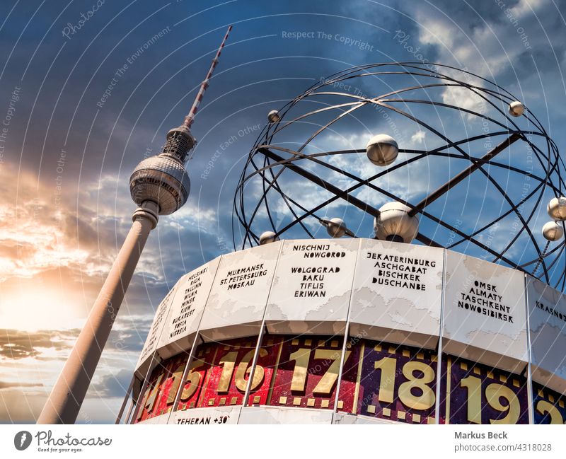 Berlin Television Tower, low angle with World clock in forefront. Sunset with cloudy sky berlin tower fernsehturm tv tourism touristic observation tower
