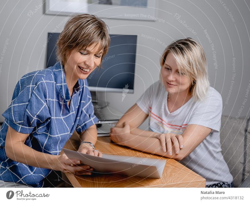 Beautyful blonde woman sitting in cabinet and talking to doctor listening health medical physician patient visit medicare people physiotherapist practitioner