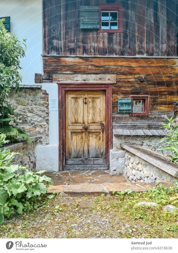 Wooden entrance door of a mountain hut Landscape Nature Doors and windows Hiking Window House (Residential Structure) Old Exterior shot Colour photo doors