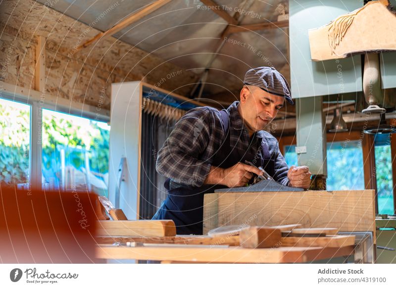 Carpenter working wit jointer plane in workshop carpenter woodworker jack plane man joiner tool manual carpentry craftsman male artisan skill joinery master