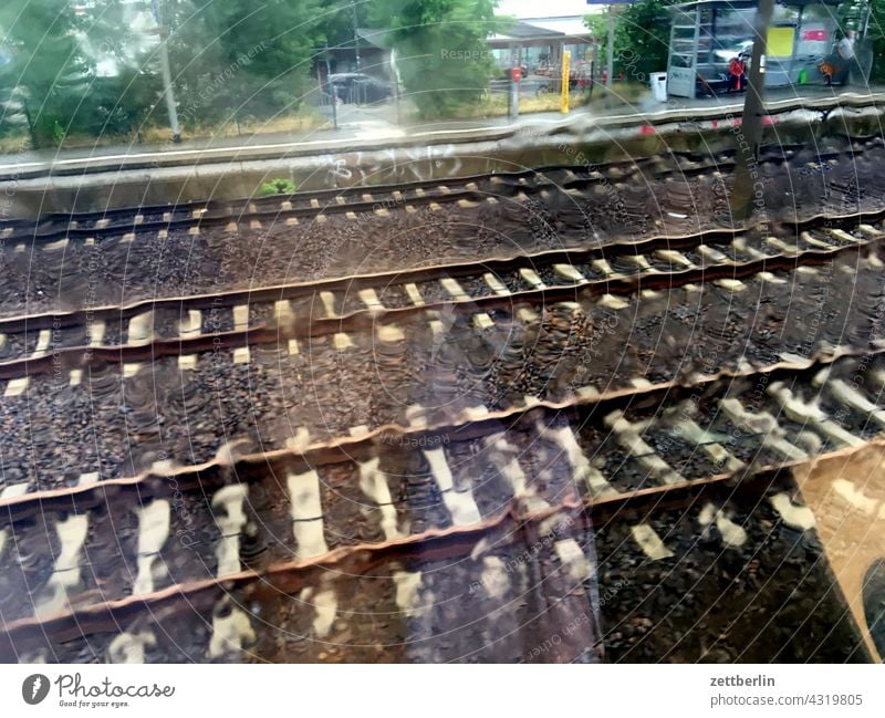 Rain on the train Railroad voyage Rail transport Tourism Transport go away on the spot Train track Track bed gravel rails sleepers Long distance traffic