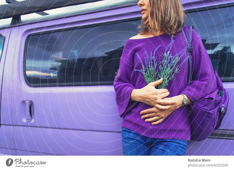 Woman with lavender flowers near the purple minivan background woman fashion floral person summer sun spring color travel relaxation passion one tenderness
