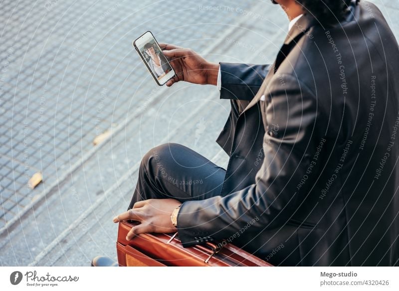 Businessman using his mobile phone outdoors. professional businessman smartphone lifestyle urban app online media worker businessmen device successful