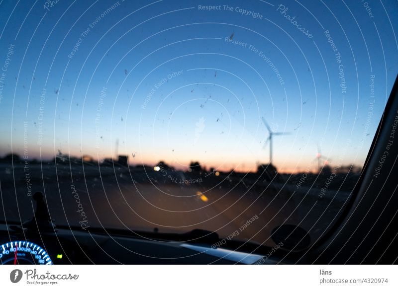 Blue hour drive Car journey blue hour Twilight Evening Sunset Light Colour photo Pinwheel speedometer Windscreen