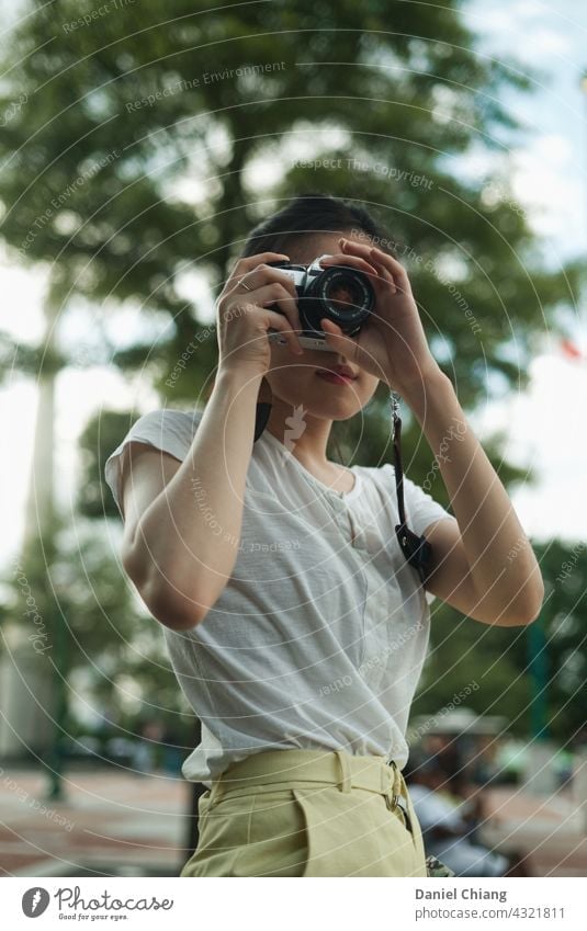 Girl Taking Picture By Film Camera film camera girl young teen fashion park afternoon travel Travel photography traveler Traveling Vacation & Travel Summer