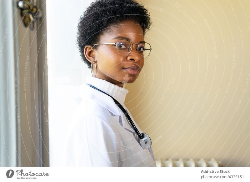 Confident black female doctor with stethoscope looking at camera medic woman health care clinic practitioner confident portrait physician young african american