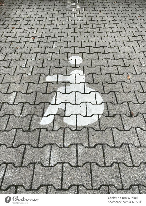 Wheelchair user symbol on paved parking lot, handicapped parking, walking handicap wheelchair users Pictogram Parking lot Disability friendly hampered