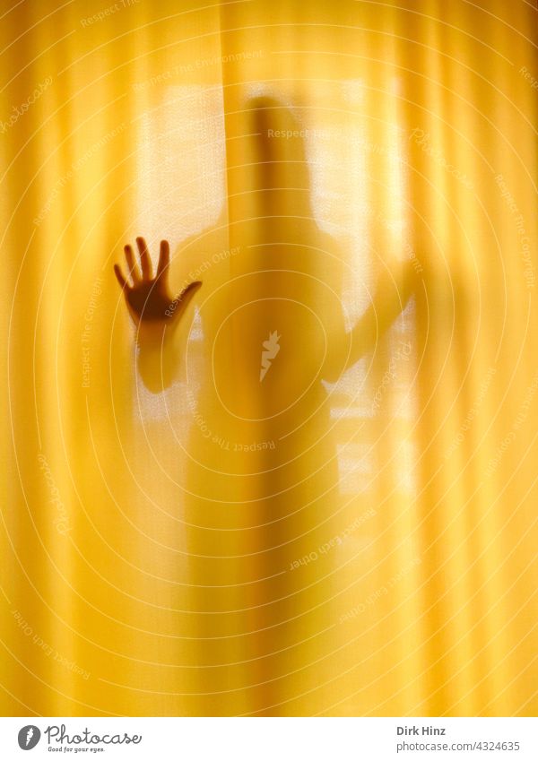 *600* Woman behind a yellow curtain Drape Window Human being Hand Sign Light Curtain Living or residing Flat (apartment) Interior shot Shadow Contrast