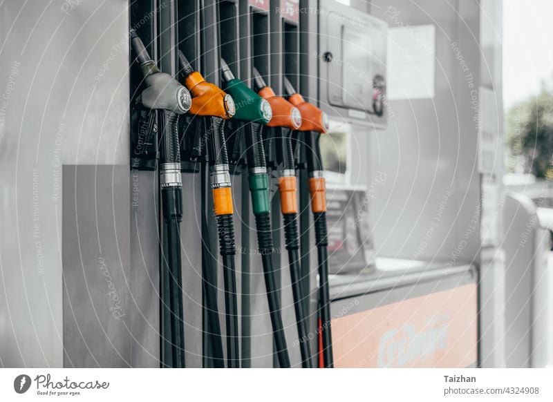 Detail of a petrol pump in a petrol station. Various refueling guns. gas hose gallon industry car equipment auto automobile diesel economy engine gasoline oil