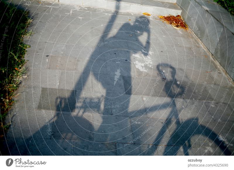 shadow of cyclist taking photo bicycle sport cycling road transportation person leisure activity bike outdoors street horizontal action exercising ride shade