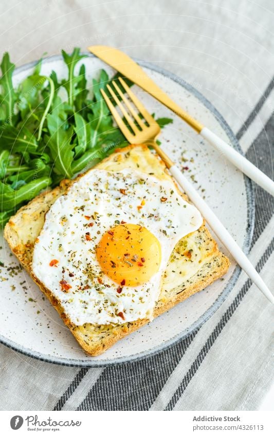 Toast with eggs and cheese food healthy meal plate cuisine dish lunch closeup vegetable diet dinner breakfast bread yolk tasty appetizer arugula background
