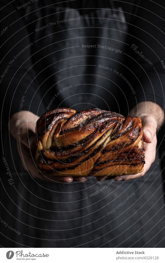 Male cook with delicious Babka cake babka dessert man homemade chocolate bakery sweet male apron pastry cuisine ingredient culinary recipe fresh food meal guy