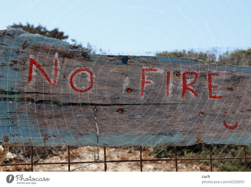 No Fire Cyclades Greece Island Building koufonissi the Aegean Mediterranean sea Forest fire danger of forest fire Nature Bans Prohibition sign interdiction