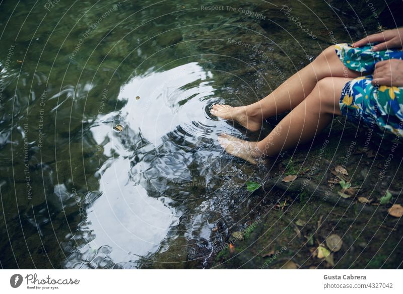 The legs of a woman diving into the water of a river. Legs Water Lake Relaxation Nature Vacation & Travel Colour photo Exterior shot Landscape Day Mountain