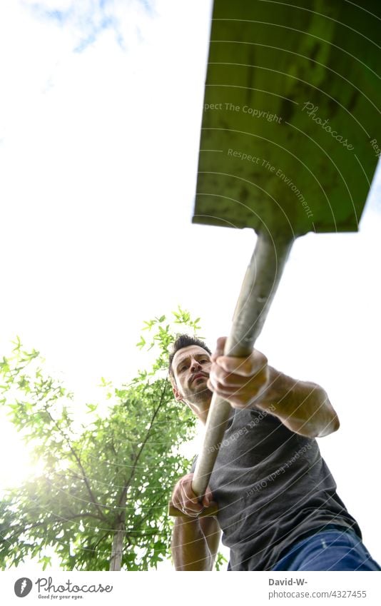 Gardening - Man with spade in garden Spade dig Gardener Shovel Nature Environment plants Tree Environmental protection Sustainability Green