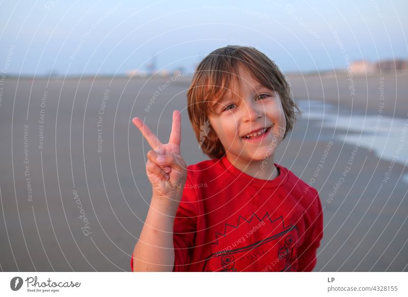 boy smiling and showing the v sign To enjoy Optimism Religion and faith Connection Positive Innocent Playful Background picture happiness lifestyle childhood