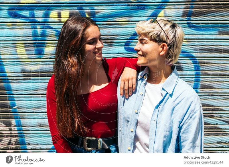 Two stylish young girls portrait looking each other two female beautiful people casual couple fashion happy together woman love relationship caucasian friends