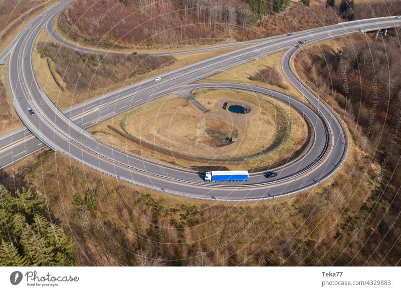 a truck on a highway landscape from above truck on highway cars speeding transportation transportation from above modern highway concrete highway exit