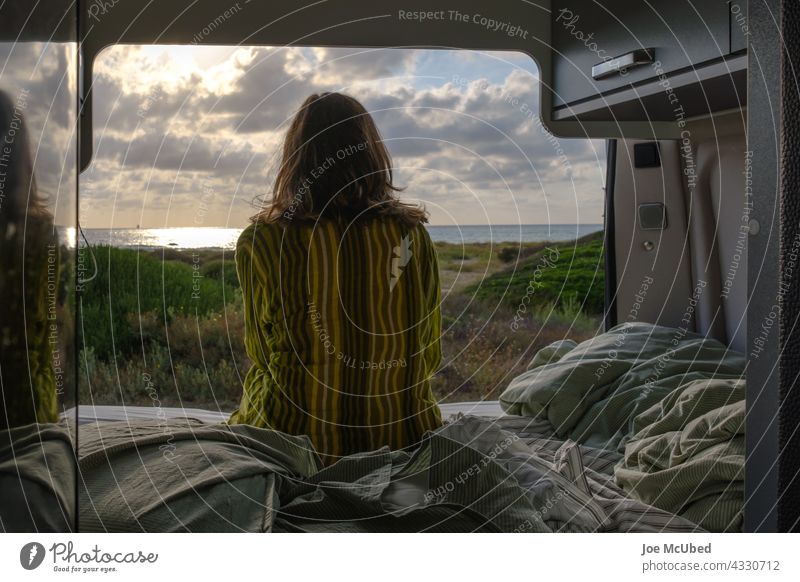 Woman gazing at the sunrise from her van Van Mobile home Camping Vacation & Travel van life Caravan Leisure and hobbies Adventure Lifestyle Freedom mindfulness