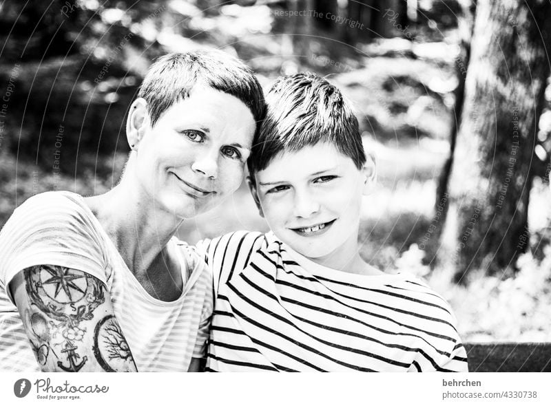 happy valentine's day <3 Affection Cuddling Contrast Sunlight blurriness portrait Light Day Close-up Exterior shot Motherly love Happy Love Son Together Trust