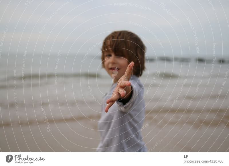 boy showing hand  at the camera Optimism Religion and faith Connection Positive Innocent Playful Senses Calm Background picture Family & Relations natural