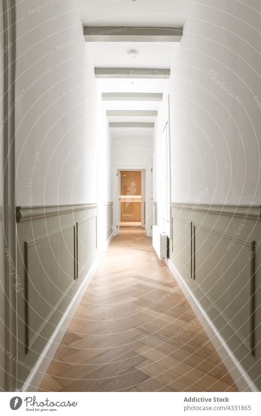 From inside long empty corridor hallway style luxury interior comfortable elegance elegant real estate modern residential decorative indoor spacious fashionable