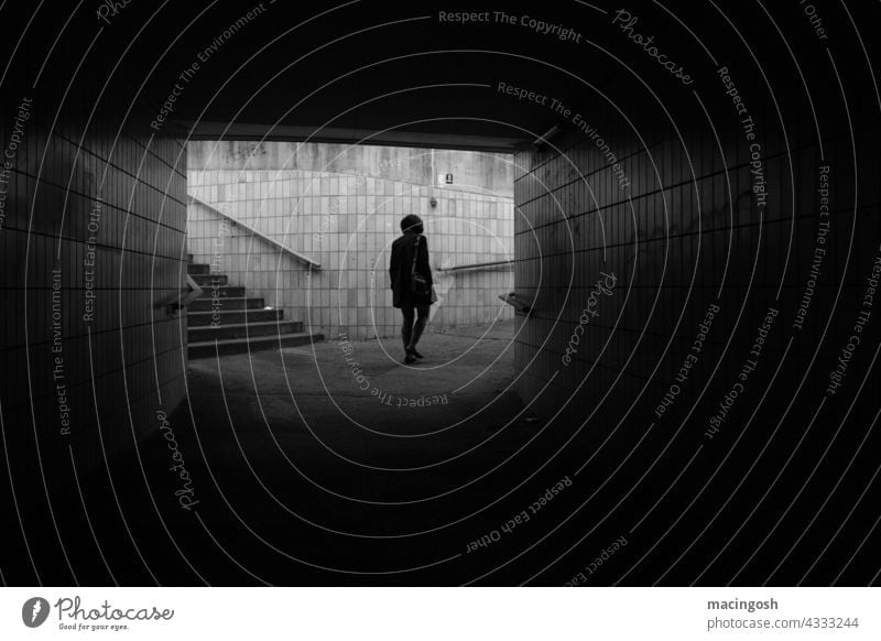 Depressed woman walks through a tunnel Tunnel pedestrian tunnel Black & white photo black-and-white Black and white photography depression dejected depressed