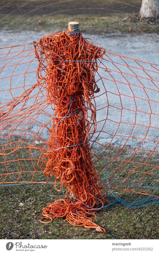 Knotted barrier net cordon Net no access havoc knotted Barrier Safety Signs and labeling Red Orange Deserted nobody Limitation Construction site muddled mazy