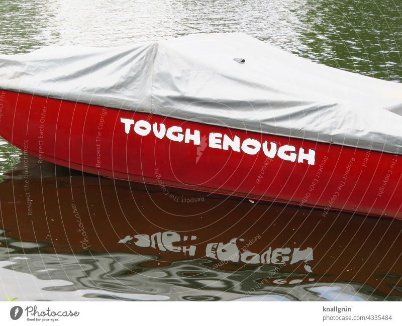 Tough enough Strong Hard Cool (slang) steady English boat Name boat name Reflection Water tarpaulin Red Body of water Swell Gray Dark Bright Letters (alphabet)