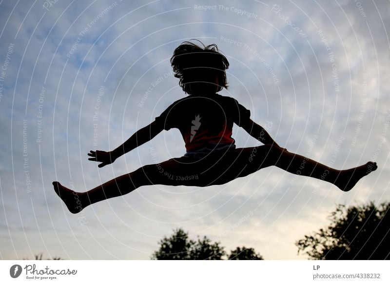 contrast silhouette of a child jumping outdoor recreation Structures and shapes Playing Harmonious Well-being Neutral Background Day Beginning Emotions