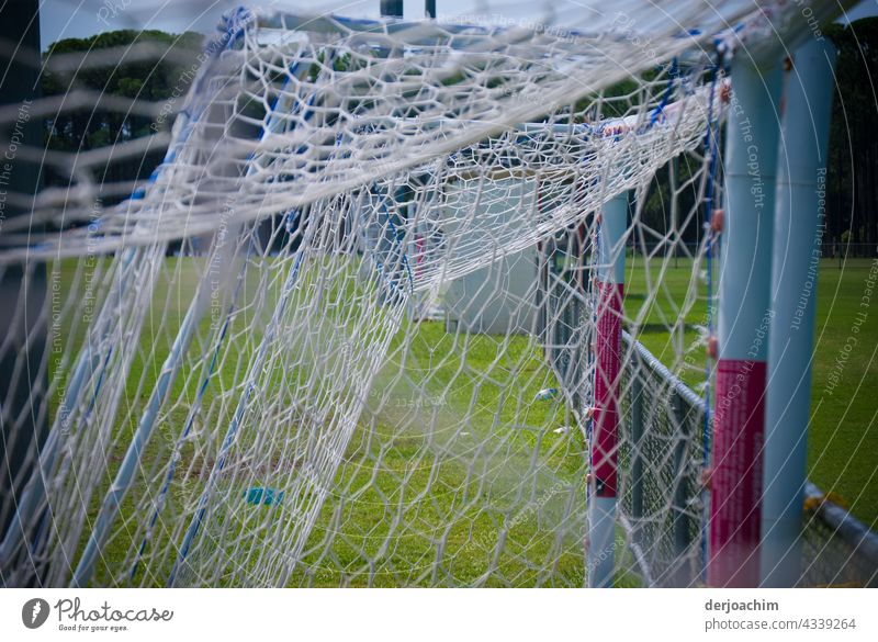 The goals were placed together at the edge of the field after practice. Goal Colour photo Deserted Day Architecture Exterior shot Net Leisure and hobbies