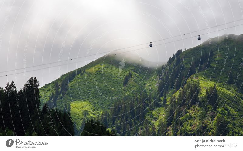 Cable car into the fog or the clouds - Cable car near Kaprun, Austria gondola lift Fog Clouds mountains Alps Storm Weather Forest Exterior shot Sky Deserted