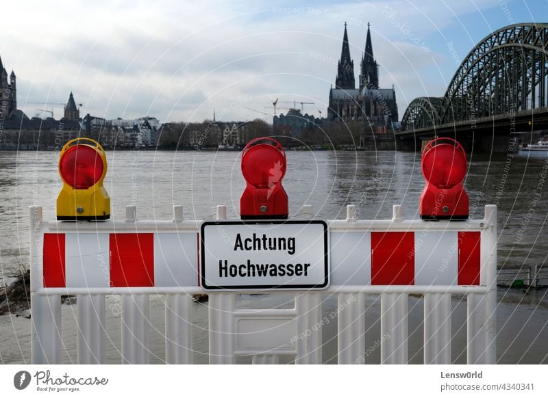Extreme weather: Warning sign at the entrance to a flooded pedestrian zone in Cologne, Germany climate climate change cologne disaster extreme weather