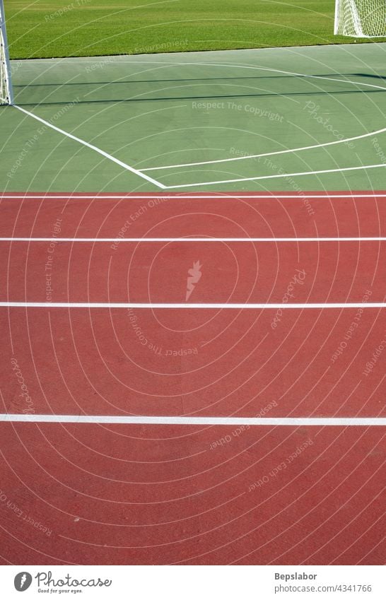 Athletic field - Track and field athletics exercise goals grass green network poles racetrack runway sports stadium synthetic action compete competition