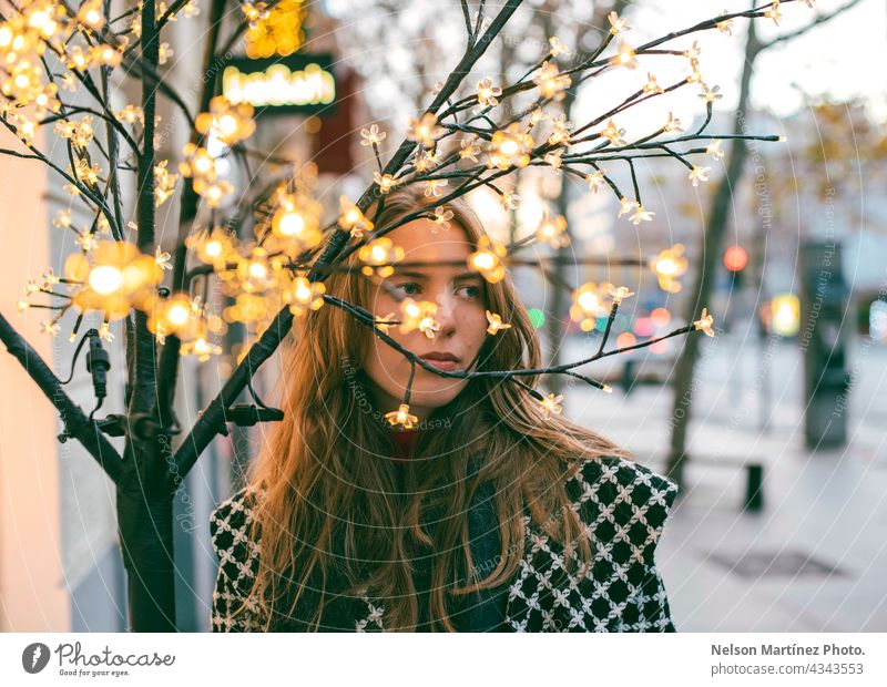Portrait of a beautiful blonde woman behind branches model bokeh holiday maker girl beauty city sunset young portrait hair blonde hair street fashion person