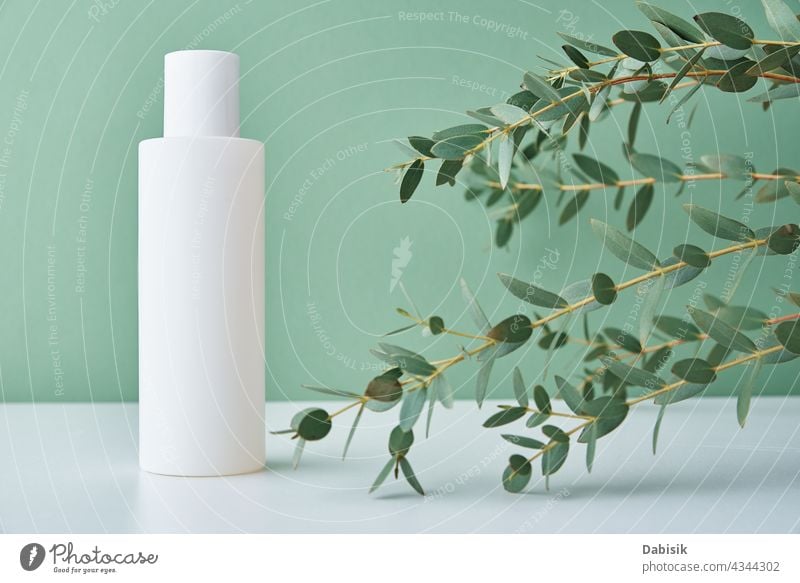 Natural cosmetic cream bottle on green background with plant product beauty package mock up label clean hygienic lotion container design white medical shadow