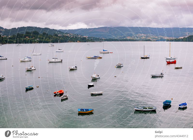 Panoramic view with sailor boats near a small village sea coast summer travel tour tourism blue water port house landscape panorama nature sky building ocean