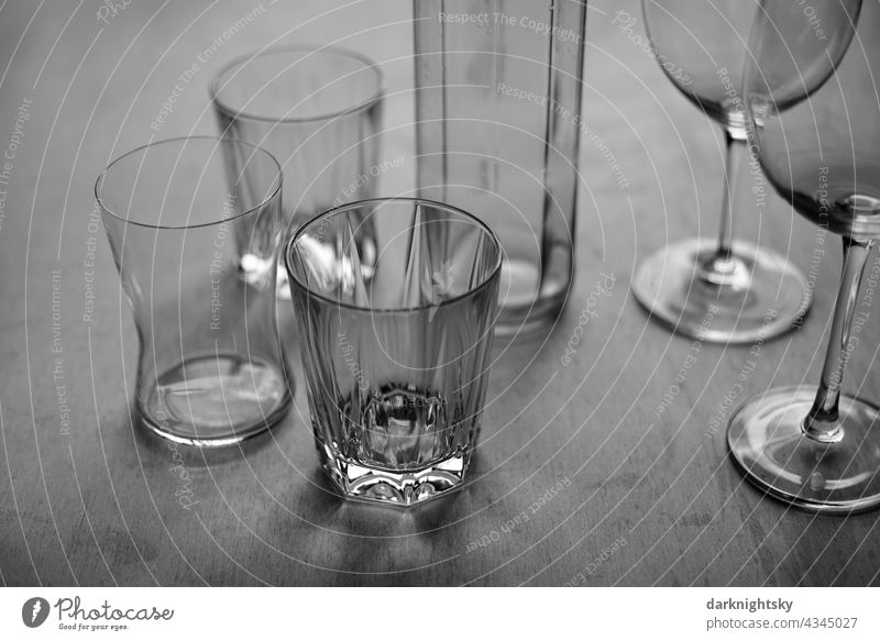 Still life of different and same glasses on a wooden table Still Life Gastronomy Glasses Table Restraurant lockdown pandemic void Losses Hope Pure Clean
