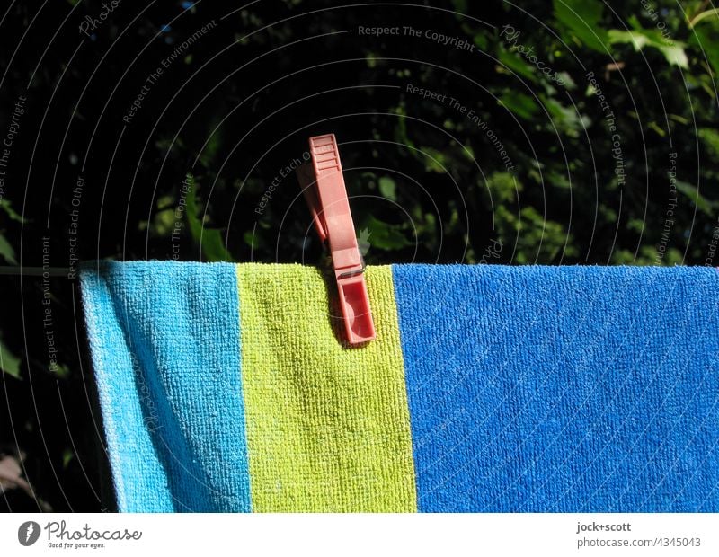 Clothespin keeps bath towel on the line clothespin clothesline Hang Dry Laundry Clean Photos of everyday life Bath towel Neutral Background Authentic