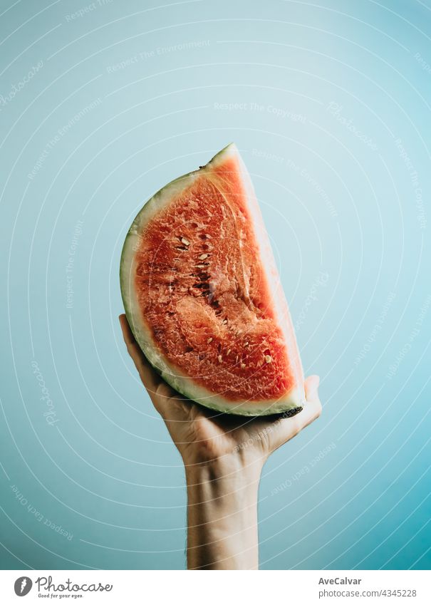 Hands grabbing a slice of watermelon top view mock up with copy space summer concept person vegetarian children freshness happy healthy eating refreshment