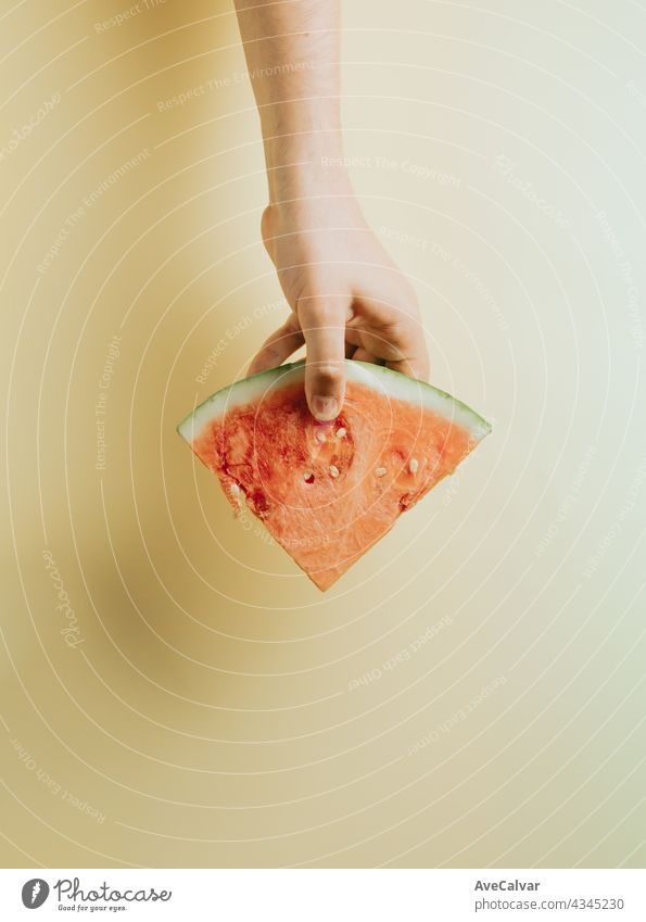 Hands grabbing a slice of watermelon top view mock up with copy space summer concept person vegetarian children freshness happy healthy eating refreshment