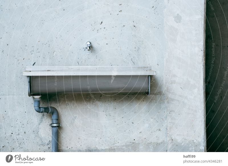Washbasin on exposed concrete Tap Drainpipe Sink Drainage Concrete wall Minimalistic exposed concrete wall minimalism Architecture Wall (barrier) Modern Line