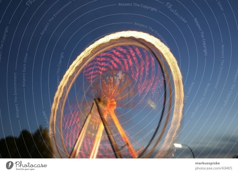 the big wheel Ferris wheel Fairs & Carnivals Night Light Long exposure Multicoloured Twilight Speed Rotate Leisure and hobbies fair Sky Blue Colour