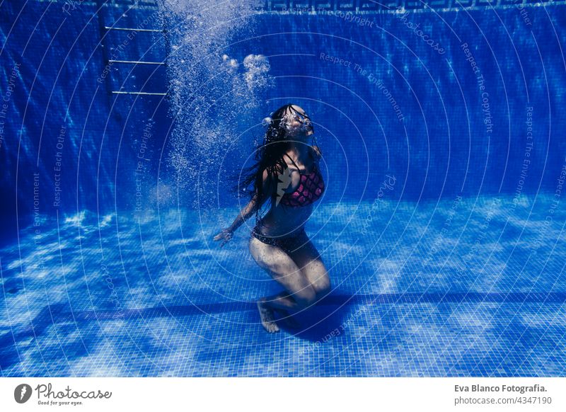 happy caucasian woman diving in swimming pool. underwater view. Summer time and vacation concept fun summer love blue water sunny day outdoors relax beautiful