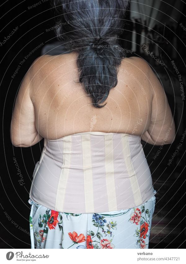 woman wearing lombo sacral corrective corset adult curvy obese fat treatment injury splint correction health equipment brace posture trauma lumbar support