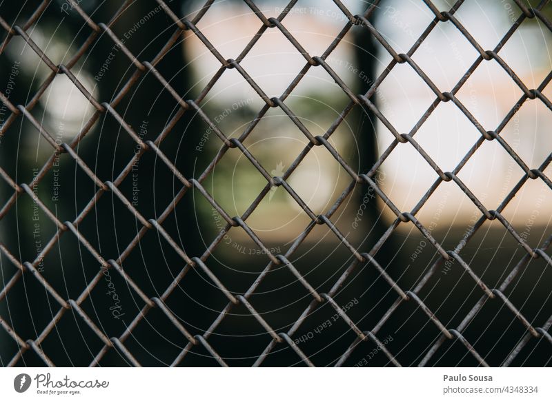 Metal chain link chainlink Barrier Fence Chain link Barred Barriers Safety Iron Connectedness Rust Connection Deserted Exterior shot Protection Close-up