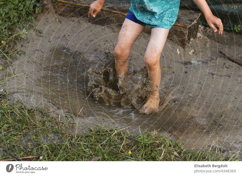 Toddler/boy mudding in wet sand slush Muding slobbery Romp play outdoors play water fun be a child Infancy Playing Dirty frowzy dirt Summer Garden