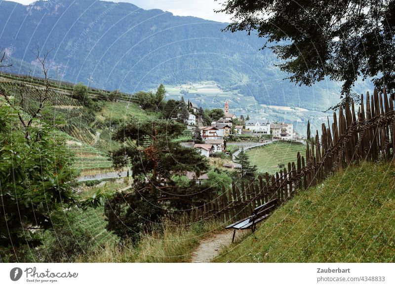 View during a hike to a village, in the foreground a bench and a fence, in the Passeier valley in South Tyrol Village Looking Valley Idyll mountains Bench Fence